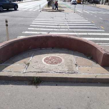 The Geographic Center of NYC is located on a traffic meridian on Queens Boulevard.
